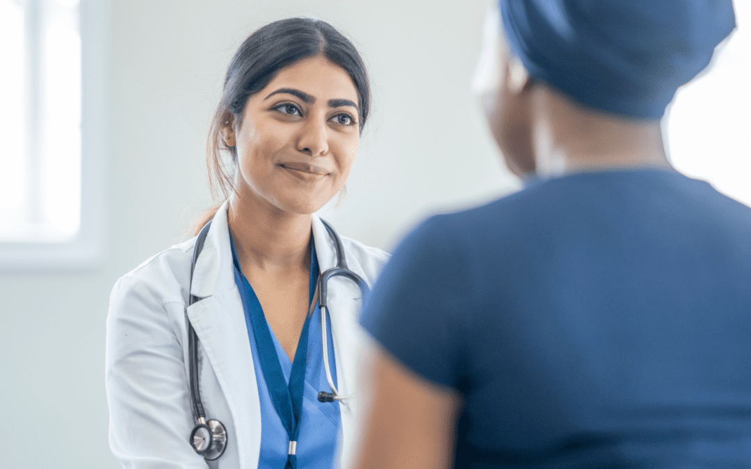 Female doctor listening to patient talking about abortion